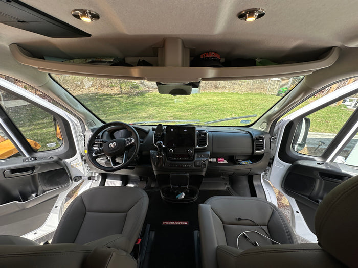 and cozy living area with seating.|RV rental van interior: view of the modern dashboard