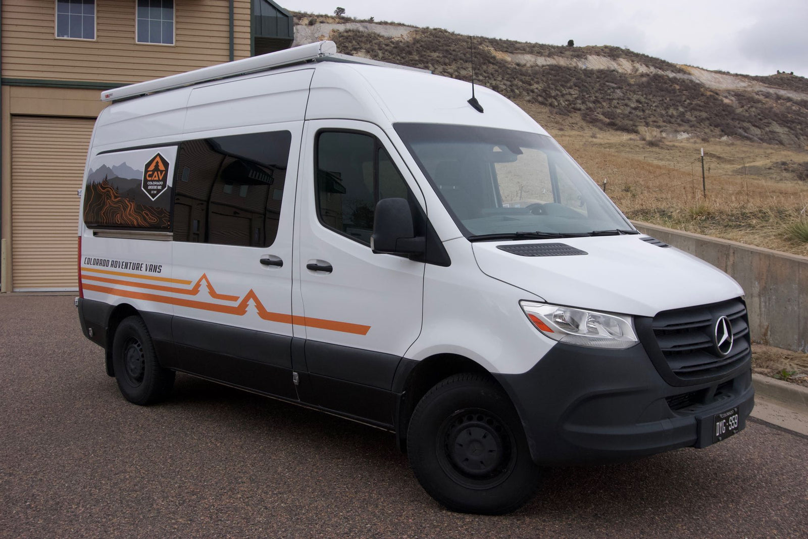 branded 'Colorado Adventure Vans
