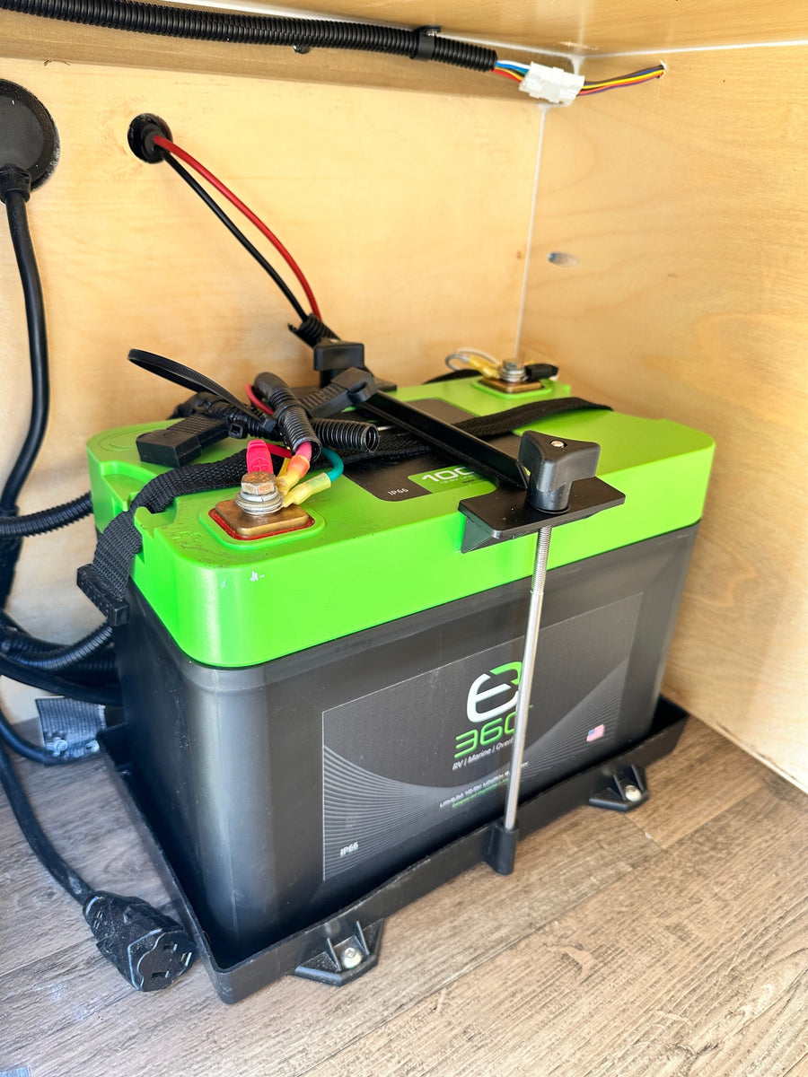 parked outdoors.|A compact Hiker camping trailer