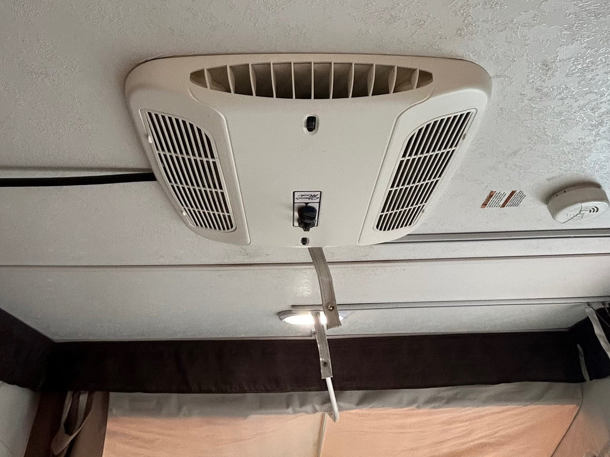 and an AC unit for comfortable camping.|Inside an RV rental: Dinette with two benches — photo 4