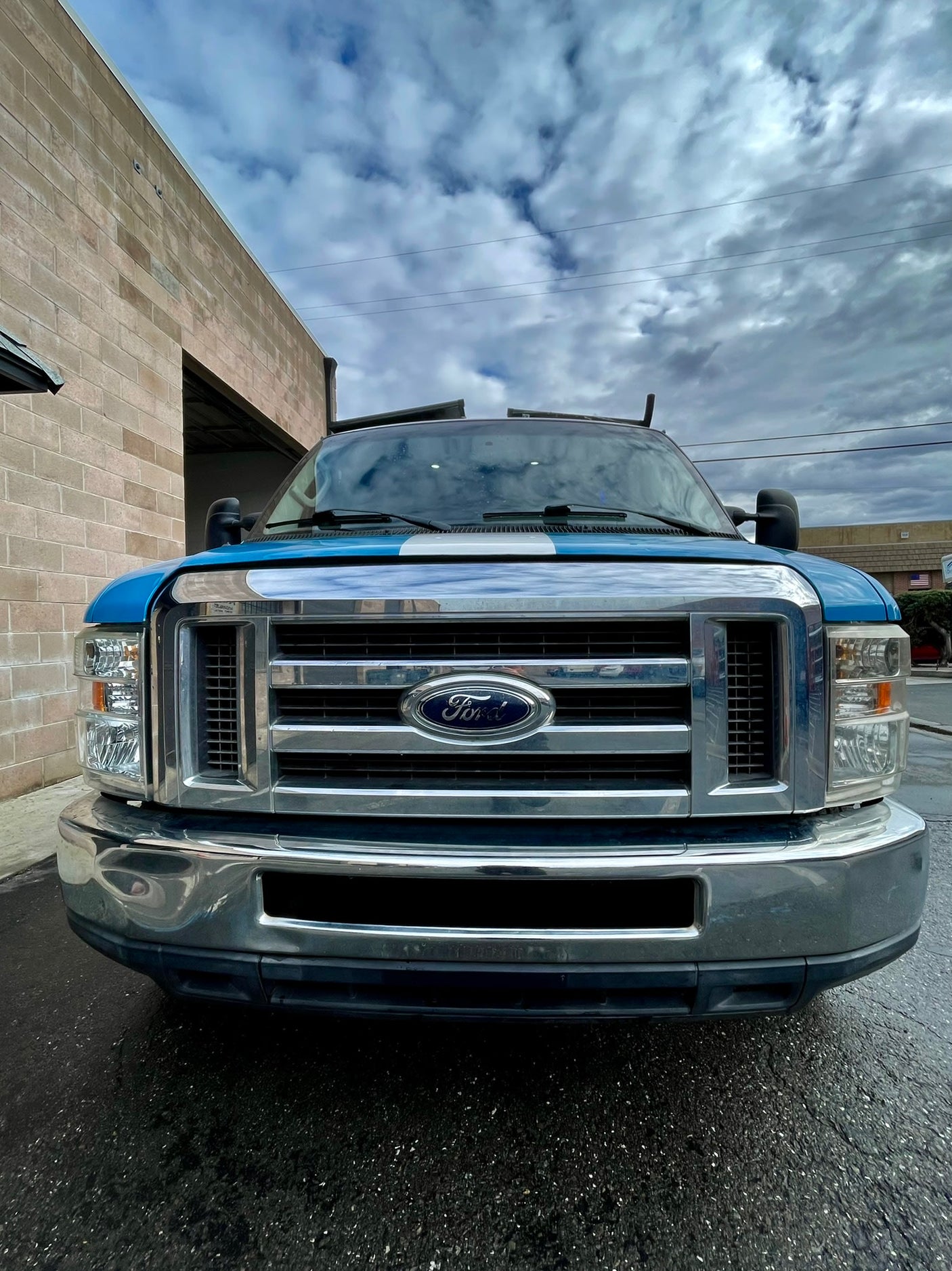 Front view of a blue Ford utility truck. Explore our other rental options, including RV rental for your adventures.