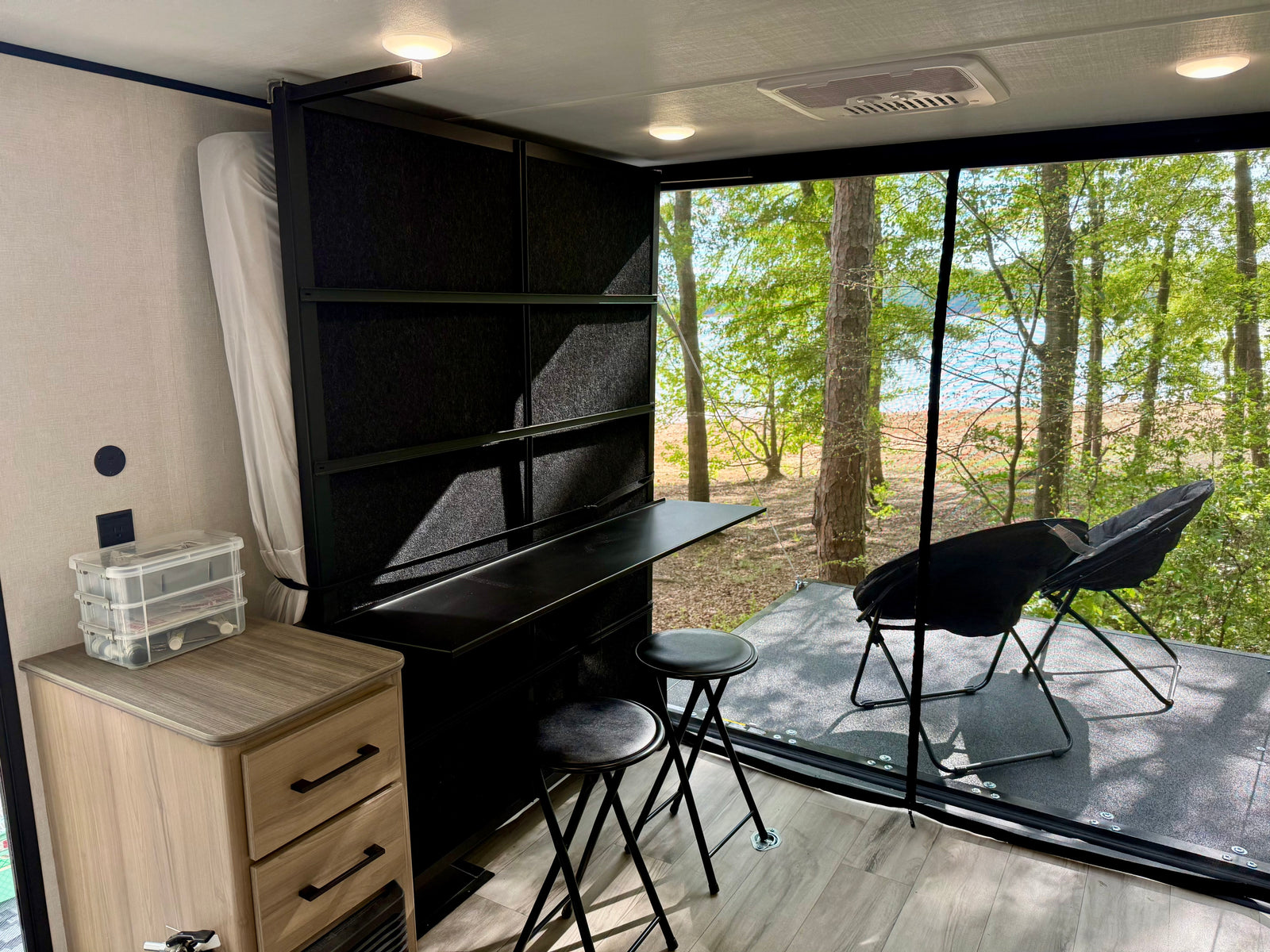 and refrigerator.|Pop-up RV rental interior: large fold-out bed