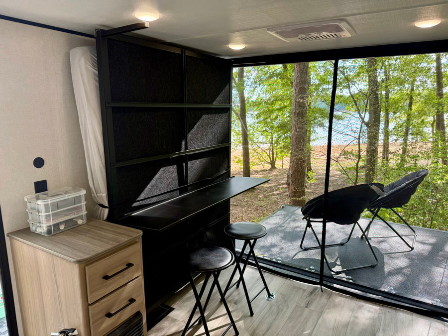 and refrigerator.|Pop-up RV rental interior: large fold-out bed