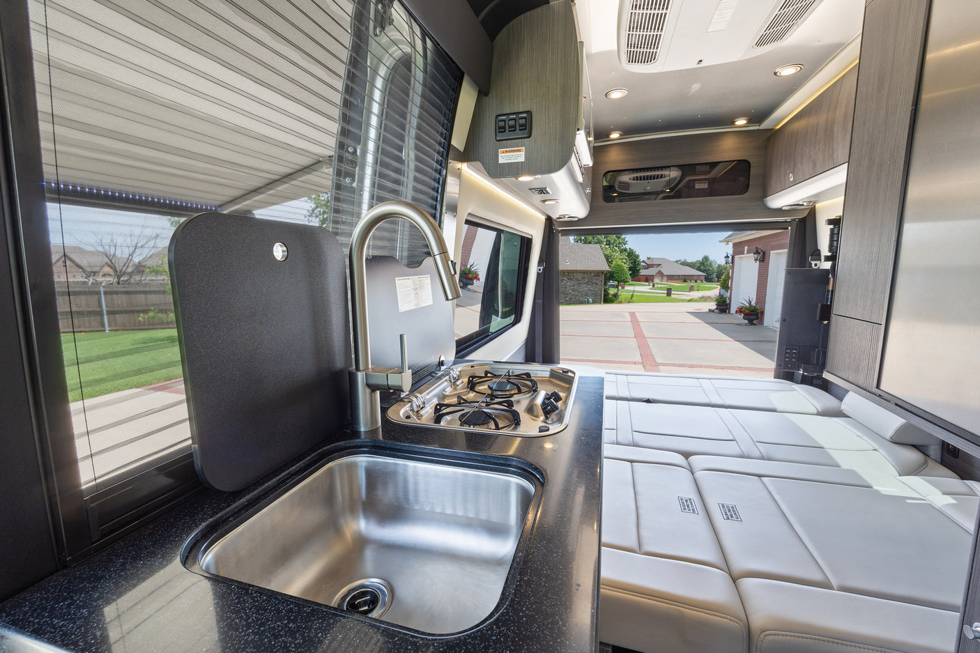 ideal for an RV rental adventure.|Spacious RV rental interior featuring a modern kitchenette
