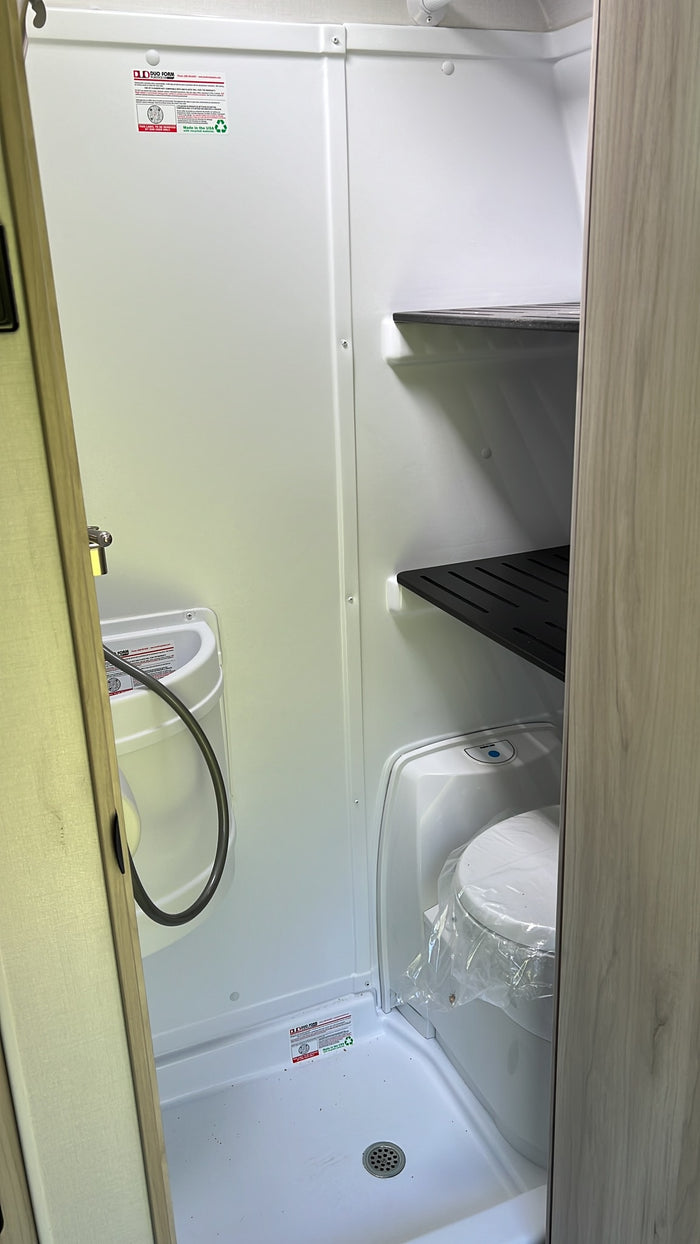 ready for your next RV rental. Perfect for outdoor adventures.|Compact RV rental wet bath with toilet