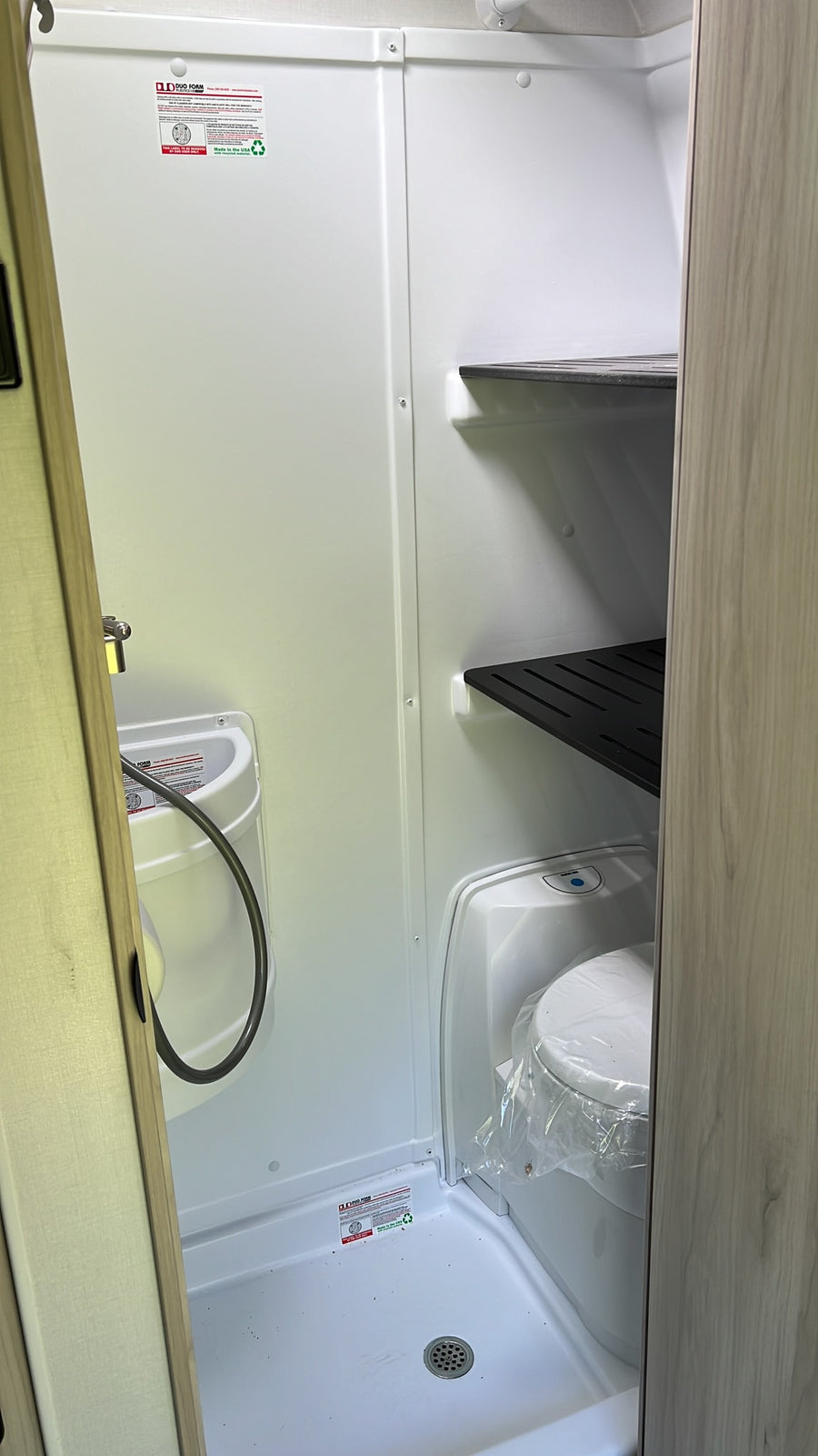 ready for your next RV rental. Perfect for outdoor adventures.|Compact RV rental wet bath with toilet