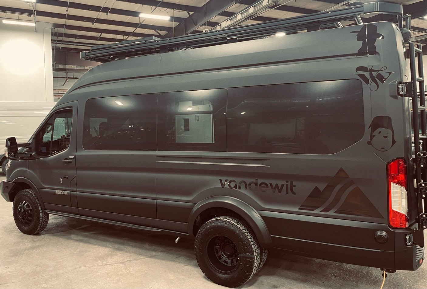 and air hose.|This custom adventure van's rear is organized for winter sports