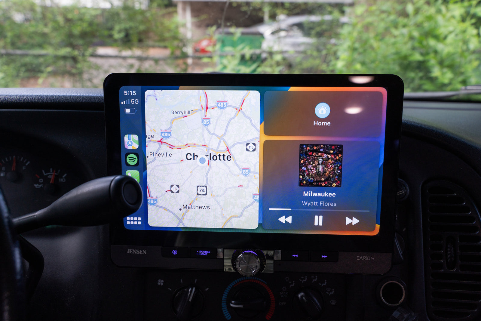 Enhance your rv rental journey with this dashboard screen featuring CarPlay navigation for Charlotte and music playback.