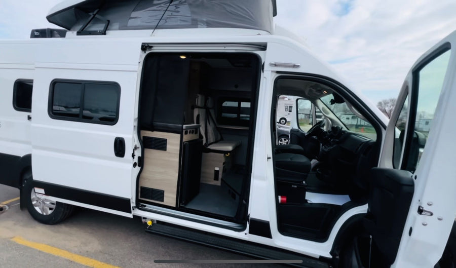 revealing a versatile interior and pop-top roof.|This RV rental features a compact two-burner kitchen cooktop and counter