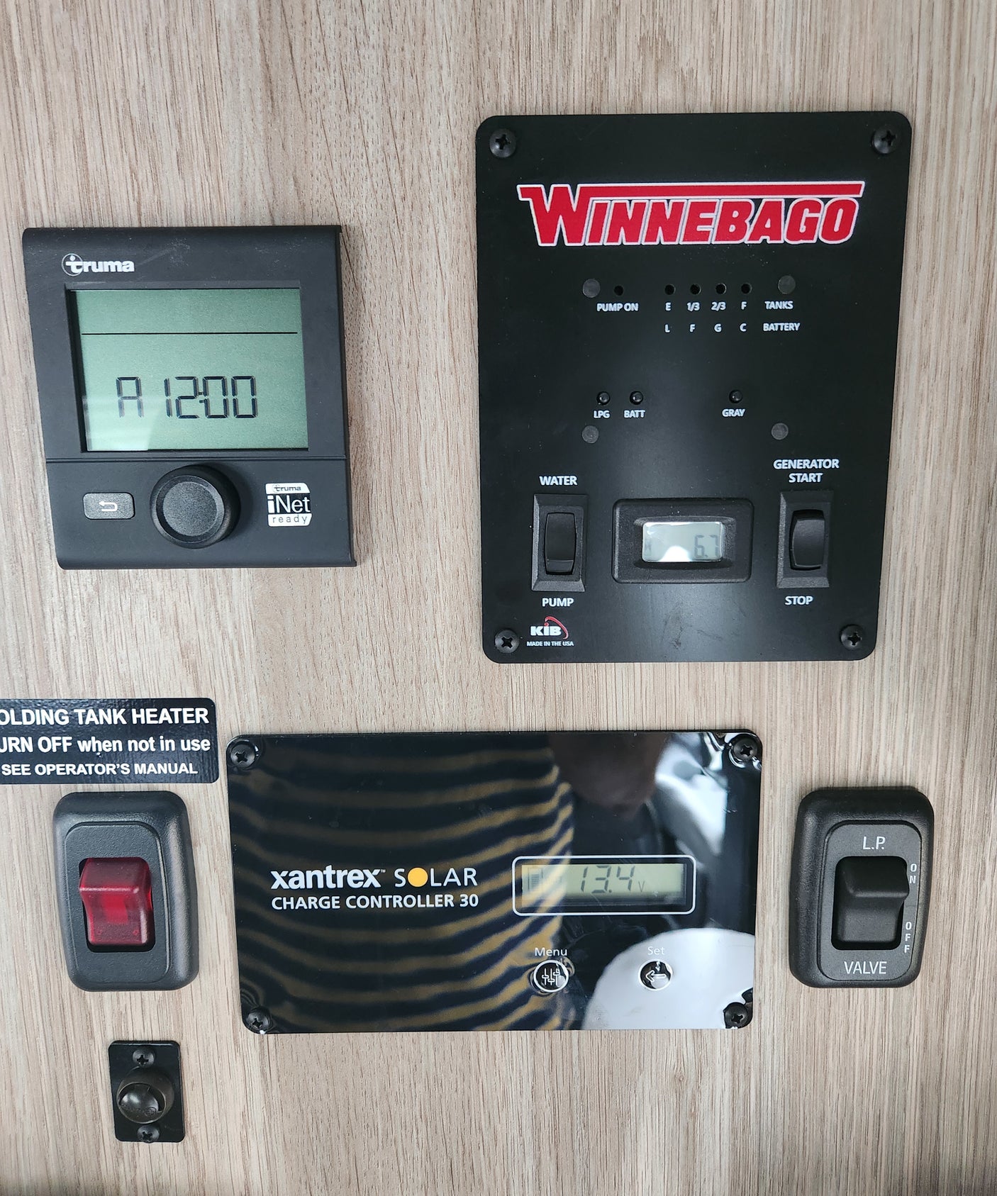 RV rental's main control panel: Truma heater, Winnebago tank/generator controls, plus a Xantrex solar charger (13.4V).