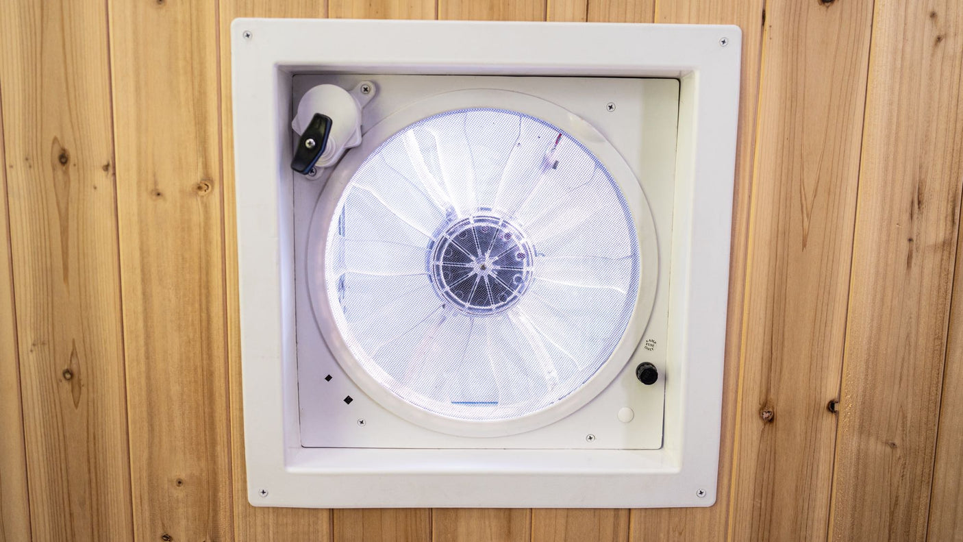 with bright blue walls.|View inside a dark RV rental oven