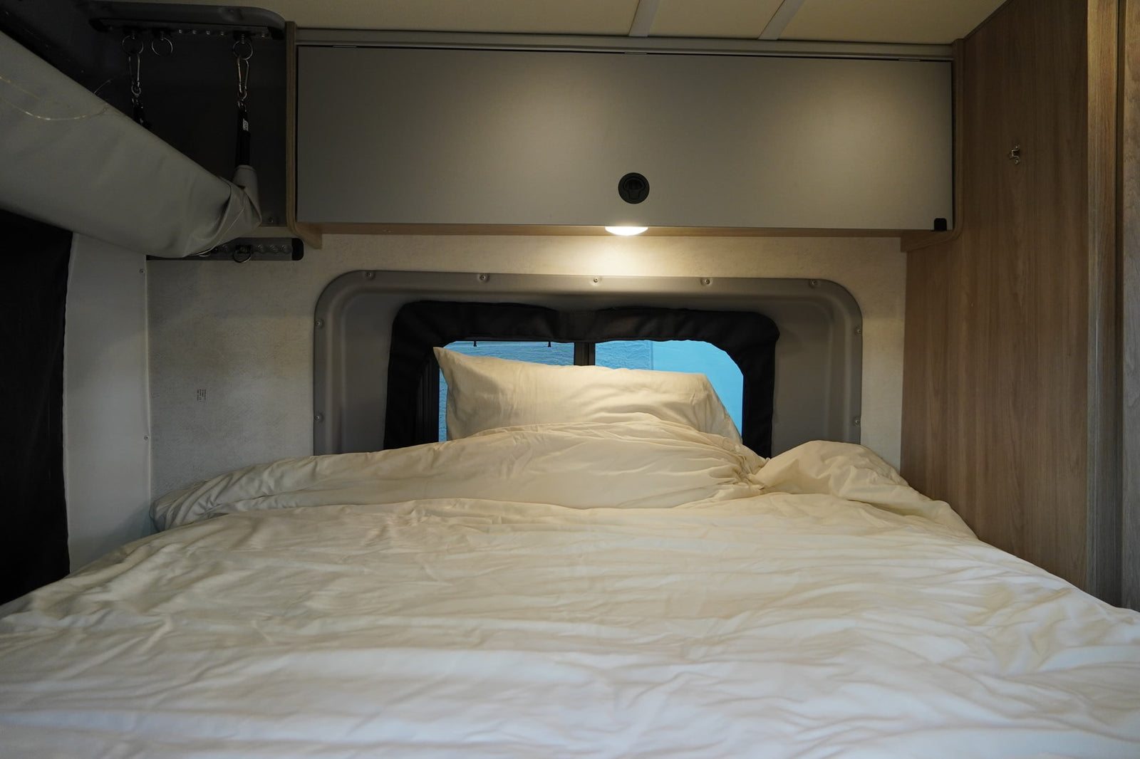 ready for adventure.|This RV rental interior showcases a compact wet bath with toilet and shower