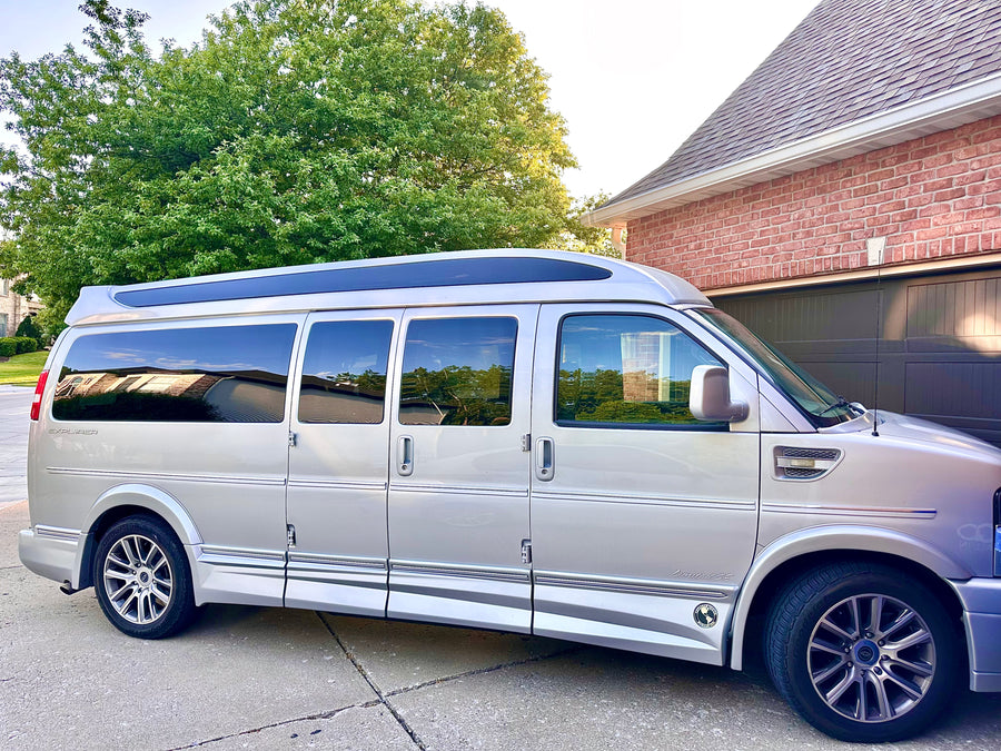 ready for your next rv rental trip. Parked on a driveway.|Silver Explorer conversion van