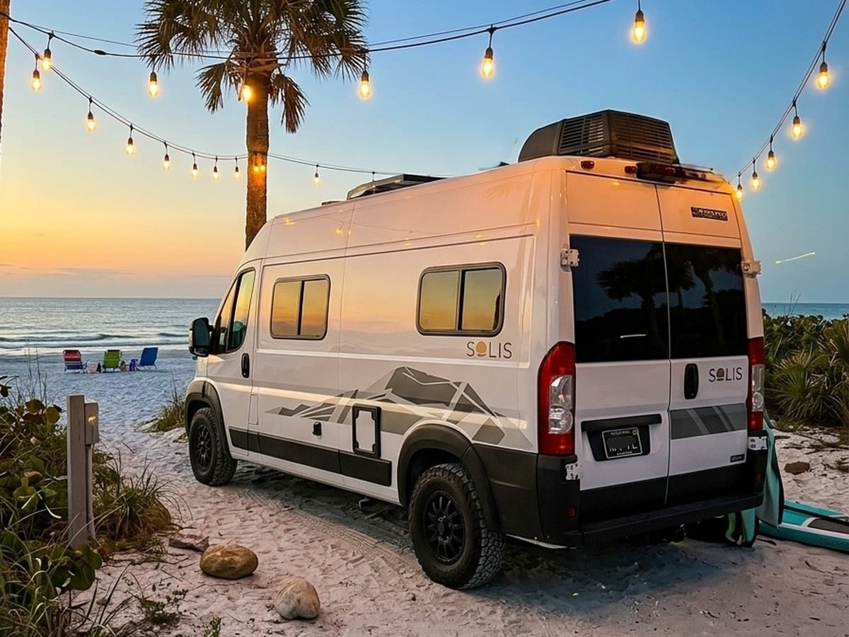 A white Solis camper van — photo 1