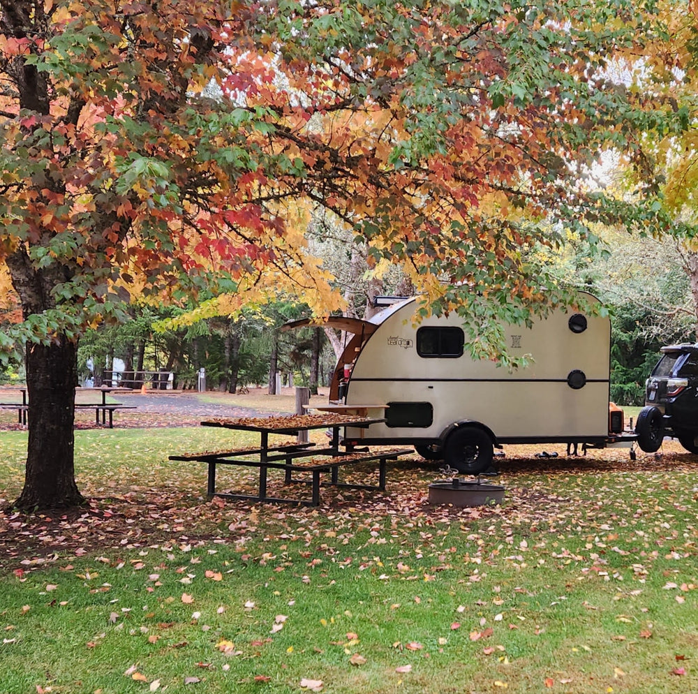 a beige teardrop trailer