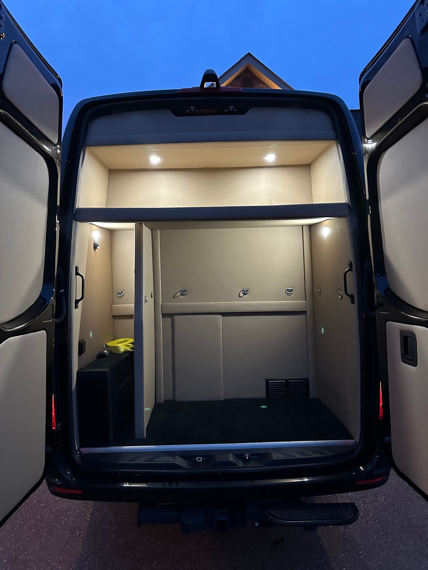 and modern dashboard. Ideal for travel entertainment.|Luxurious RV rental interior: spacious cabin with brown leather seating
