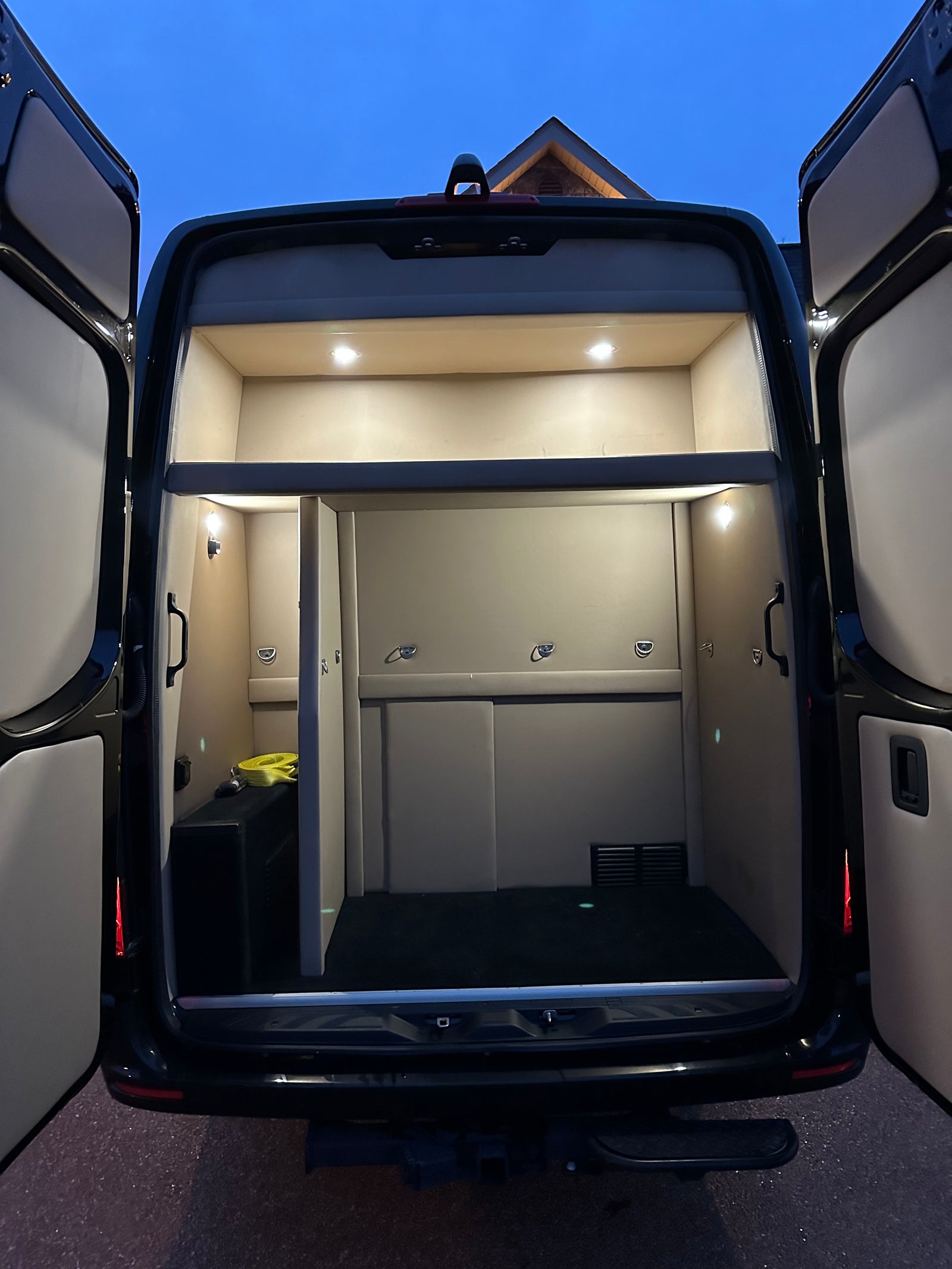 and modern dashboard. Ideal for travel entertainment.|Luxurious RV rental interior: spacious cabin with brown leather seating