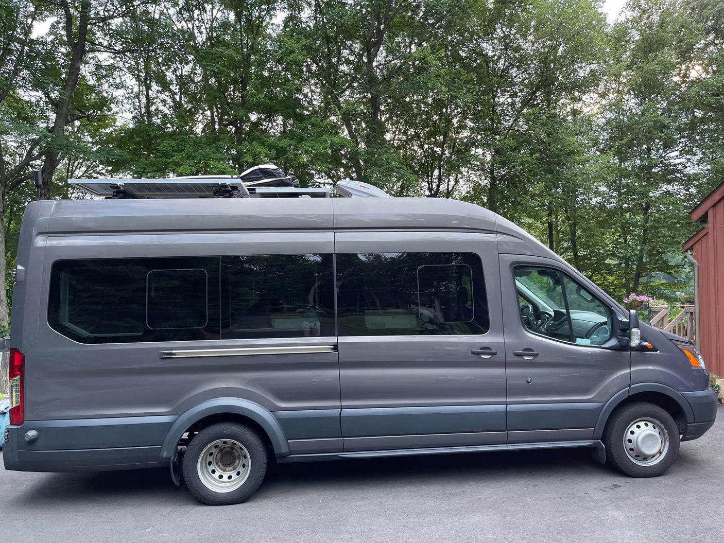 fresh carrots & cucumber on a wooden board.|Stylish **RV rental** for van life: Features a wooden dinette