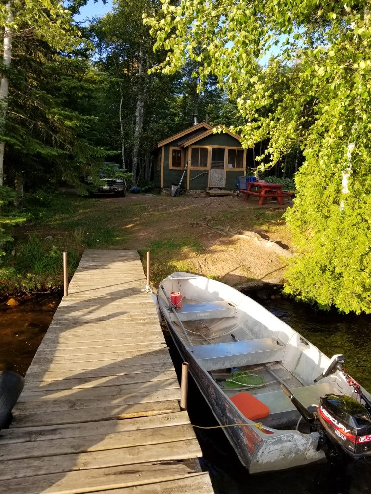 Waterfront cabin with private dock & boat. Imagine parking your **rv rental** here for a tranquil escape!