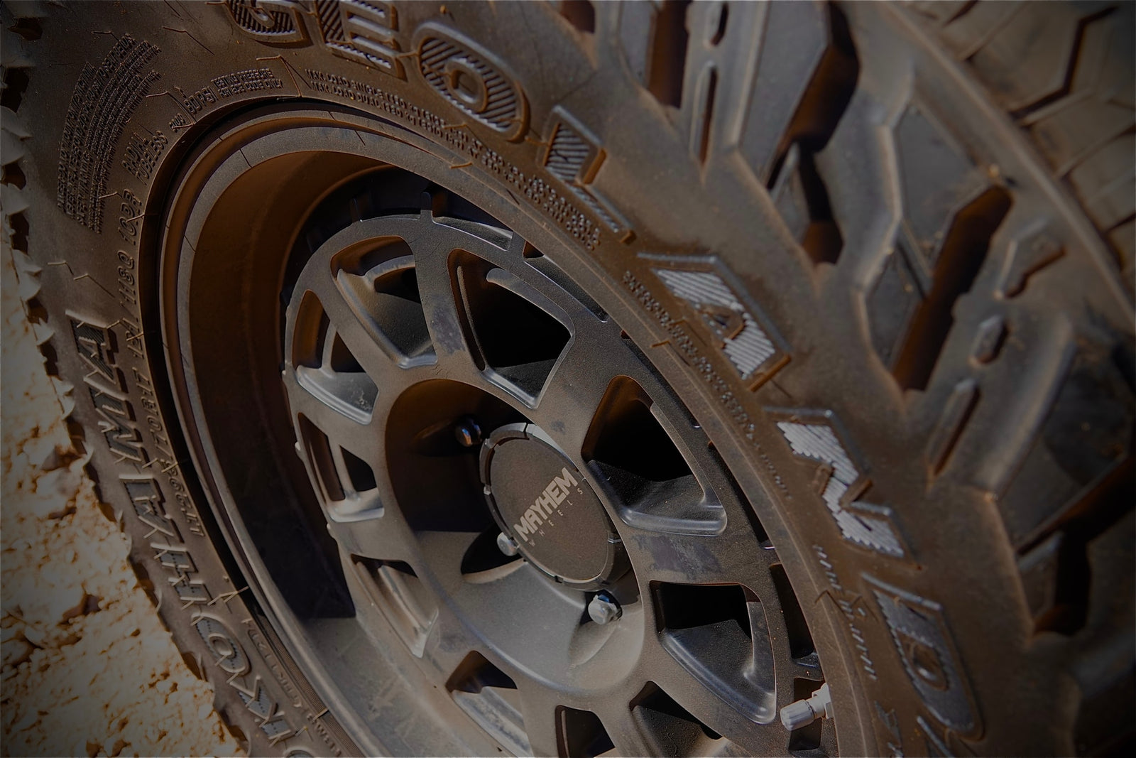 Rugged off-road tire and Mayhem custom wheel, ideal for a memorable RV rental adventure.