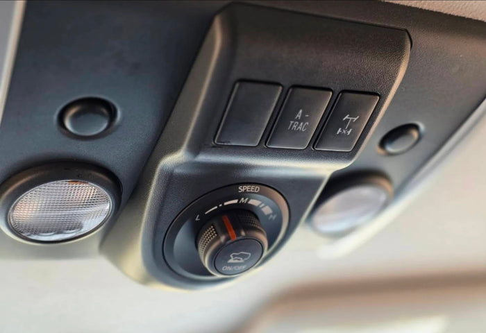 ready for adventure in a dry field. An ideal option for a nature-focused rv rental trip.|A grey Toyota FJ Cruiser