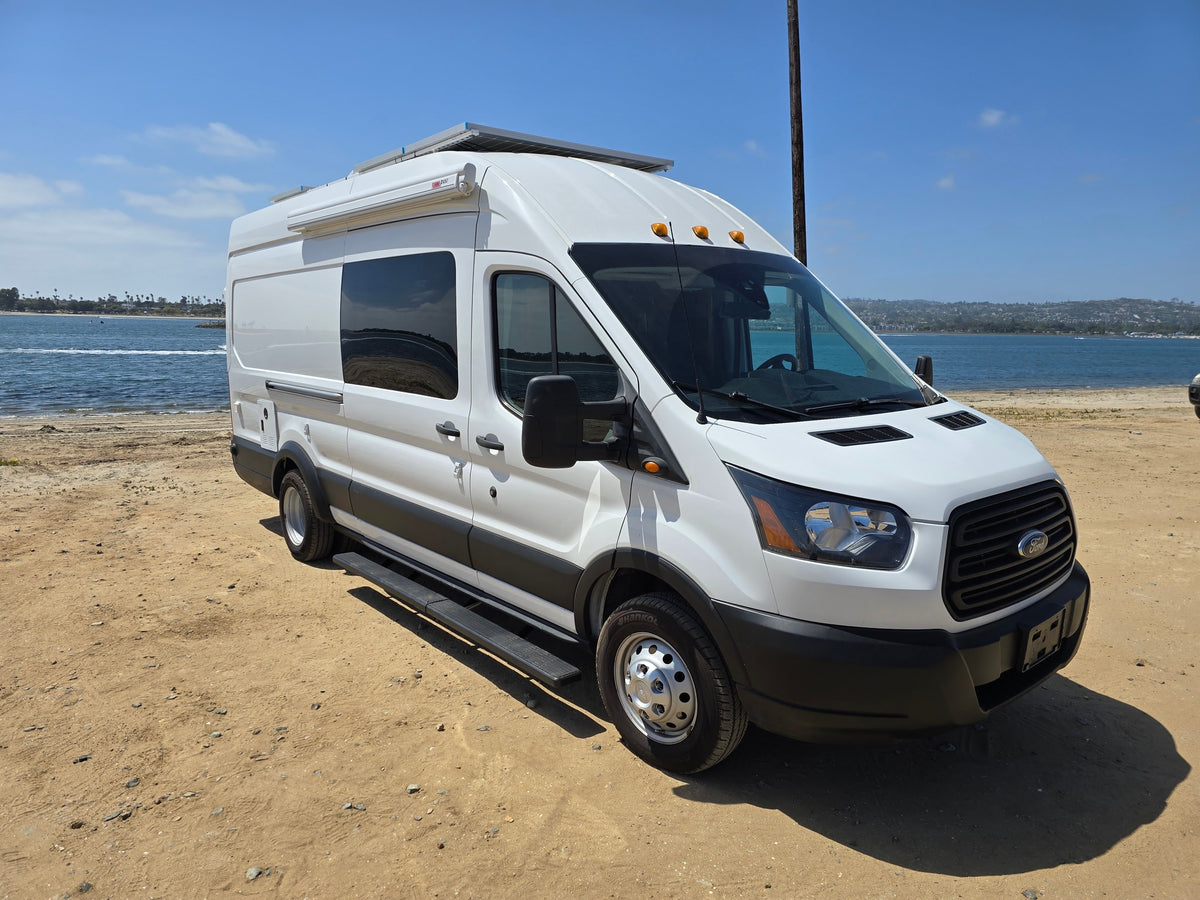 A white rv rental camper van