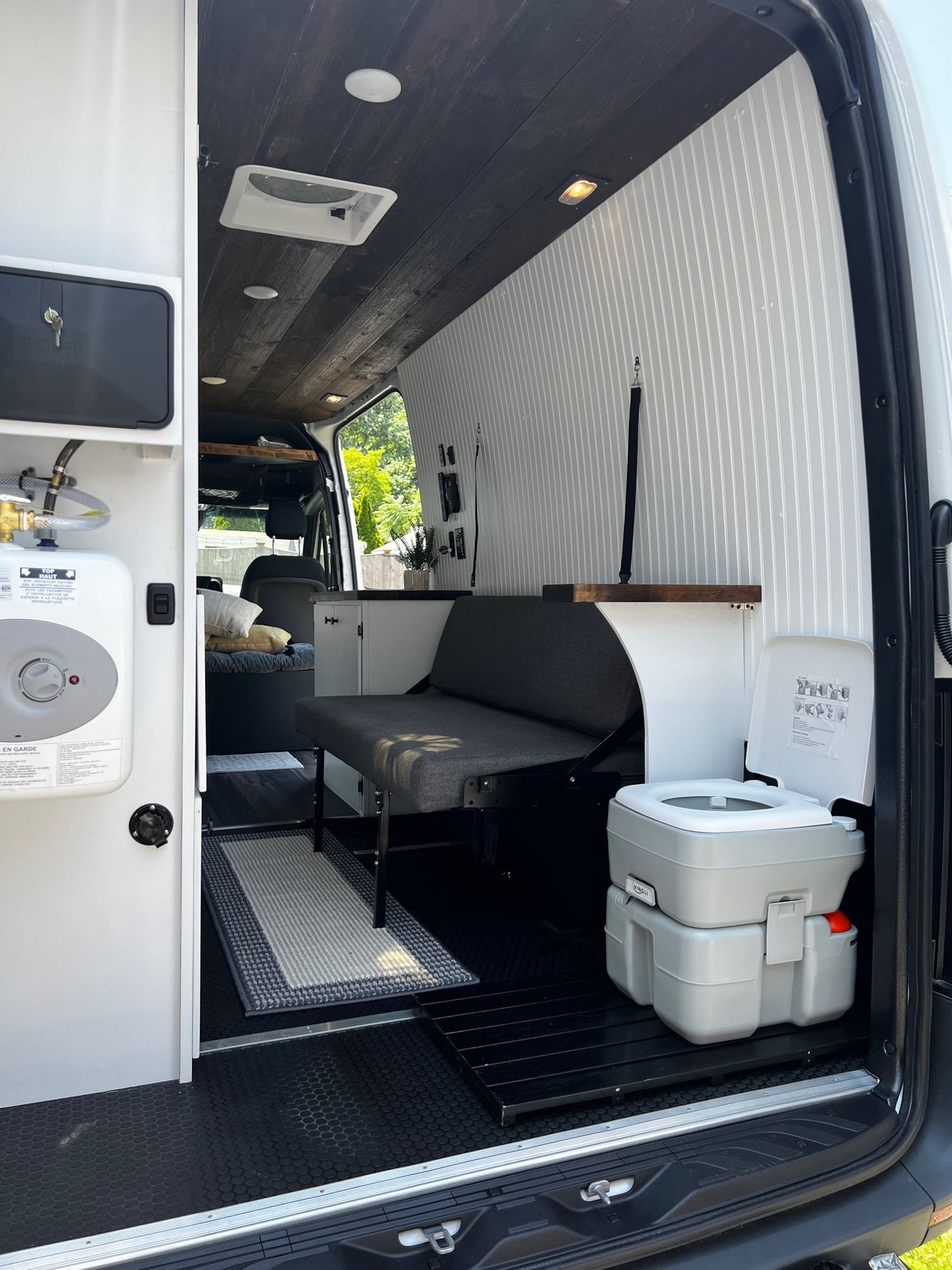 and practical storage cabinets.|A comfortable RV rental bedroom featuring a full bed
