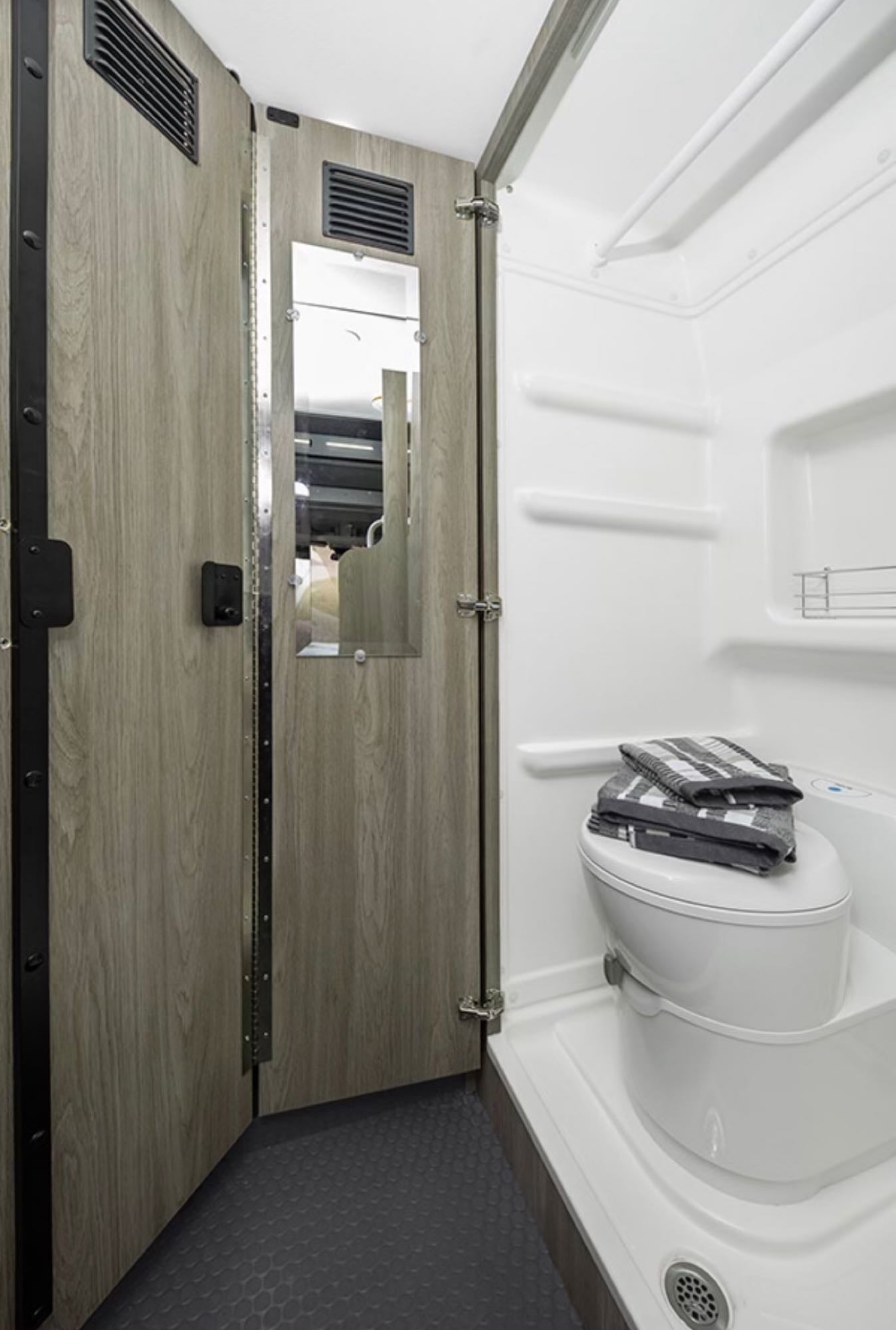 and a ceiling vent for comfort.|RV rental interior: Kitchenette with sink/stove