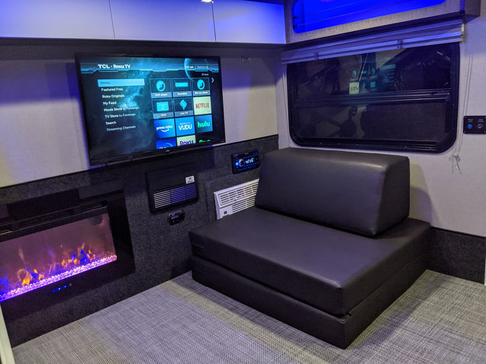 This RV rental offers comfort with a smart TV (Roku, Netflix), electric fireplace, and convertible sofa for an ideal travel experience.