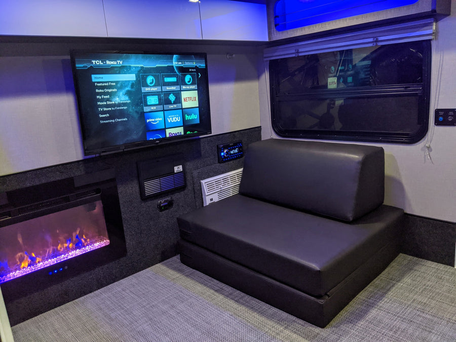 This RV rental offers comfort with a smart TV (Roku, Netflix), electric fireplace, and convertible sofa for an ideal travel experience.