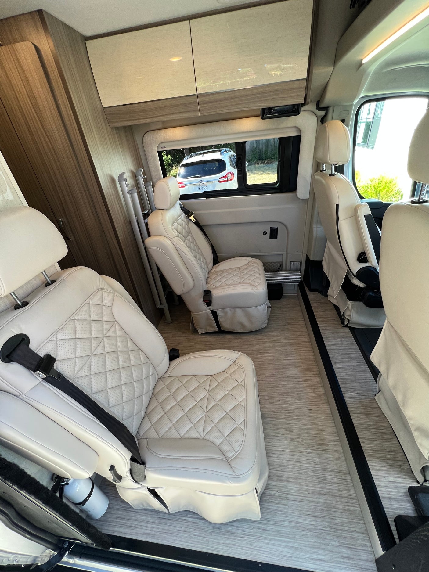 RV rental: Plush, quilted captain's seats and sleek modern interior cabin. Ready for comfortable travel.
