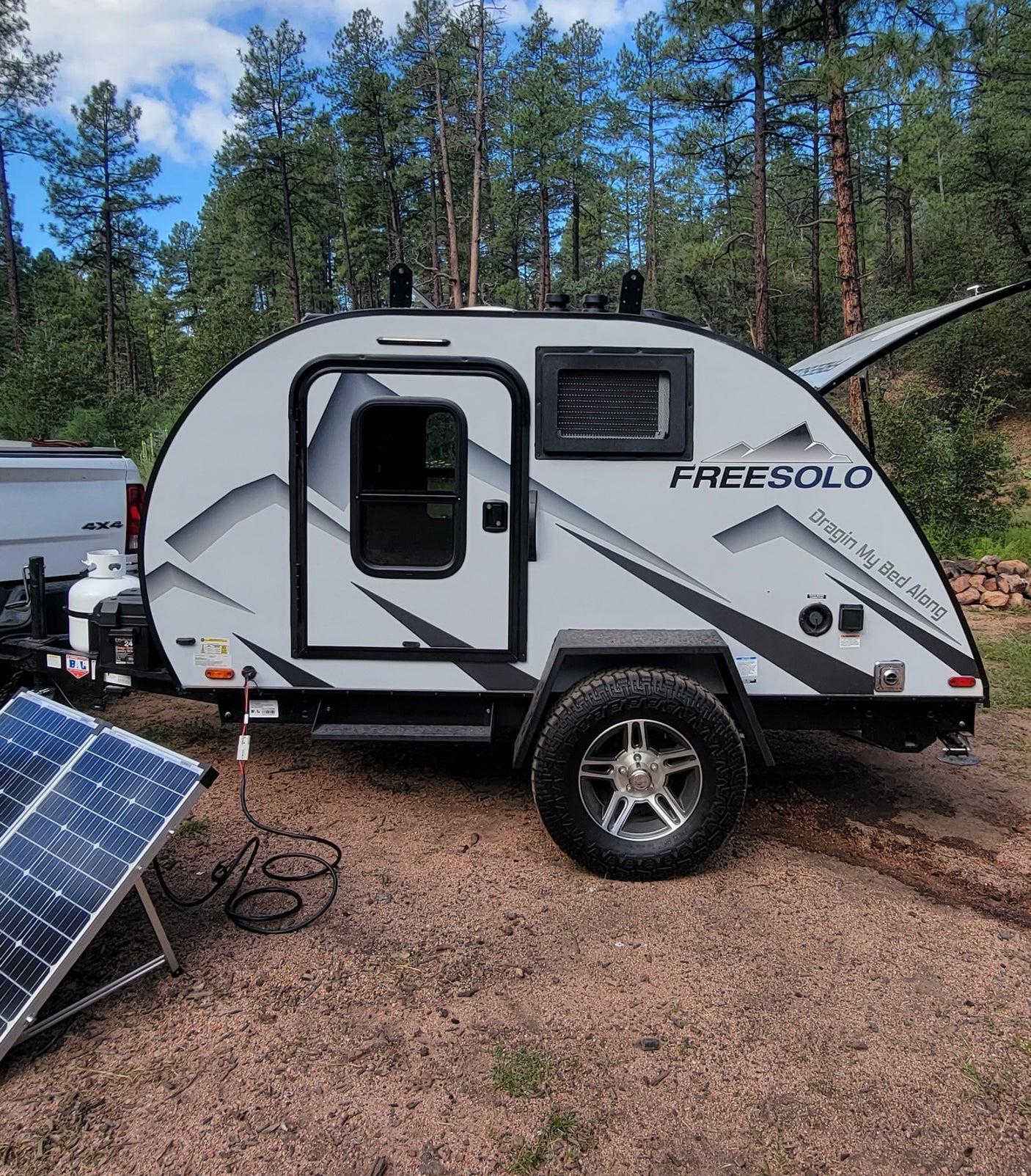 This FreeSolo teardrop camper trailer is an ideal RV rental for off-grid camping, with portable solar panels.