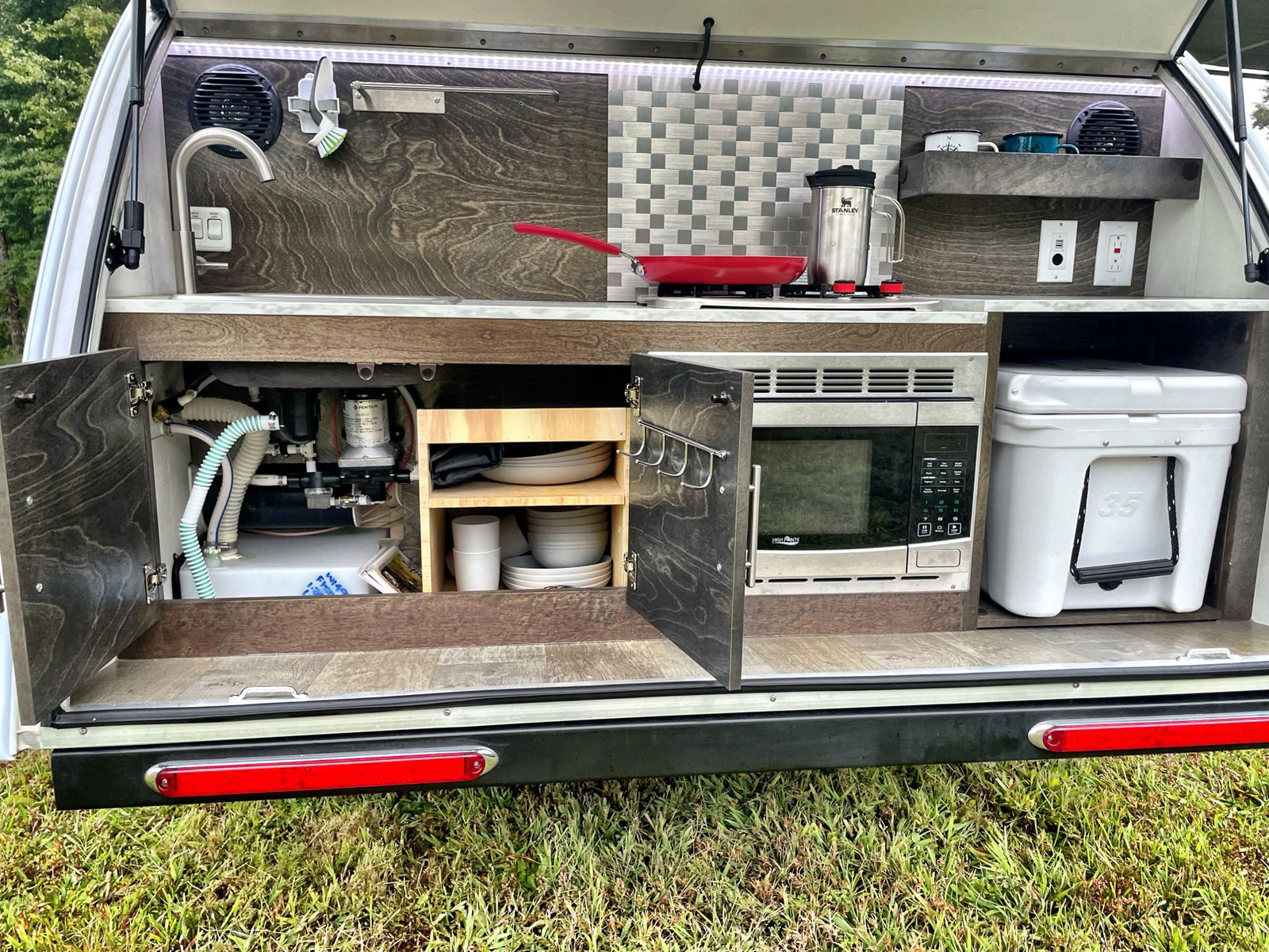 and scenic windows for comfortable travels.|An RV rental's multi-functional window with insect screen & privacy blind