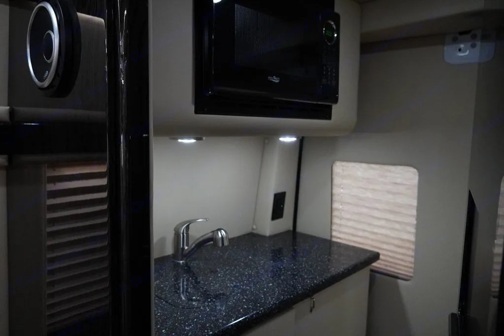 providing ultimate comfort for travel.|Spacious rv rental interior: cream quilted leather front seats