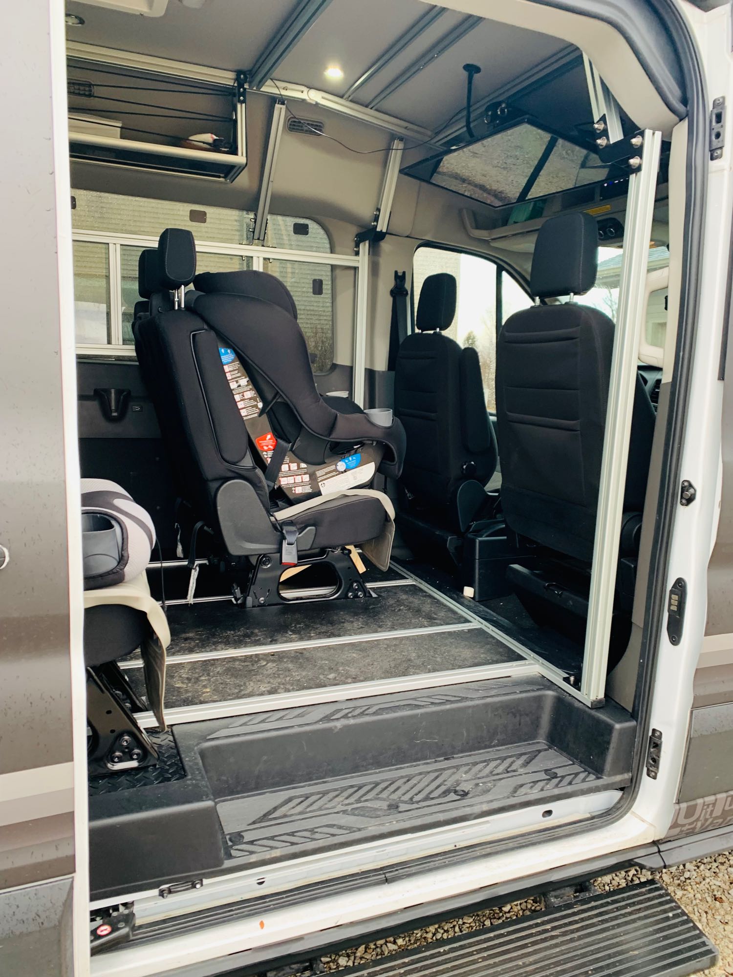flexible floor system for adventure.|Customized camper van with open rear doors