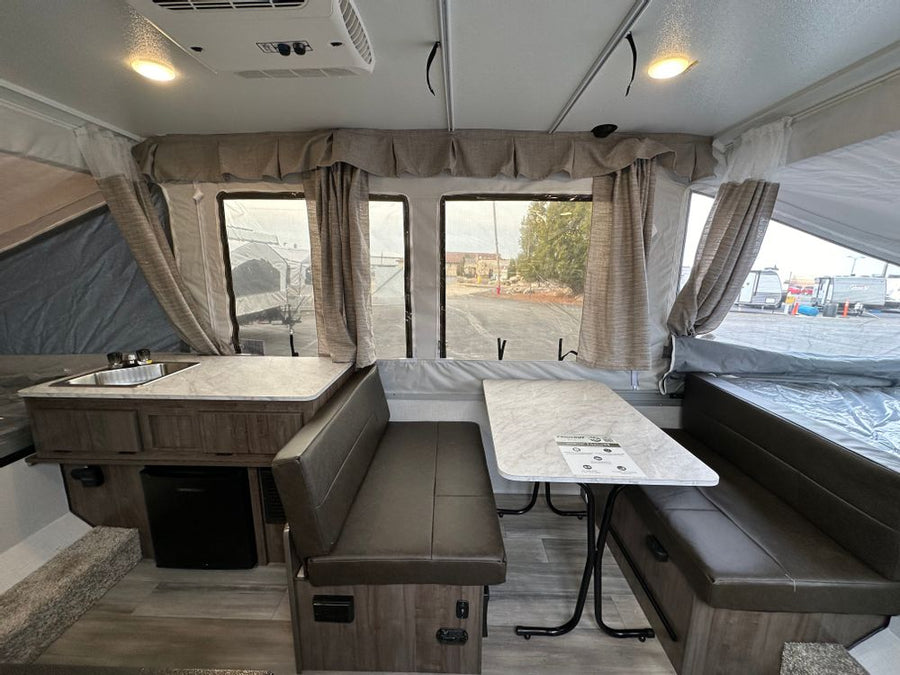 available for RV rental and outdoor adventures.|Detailed RV rental floor plan: pop-up camper interior with kitchen