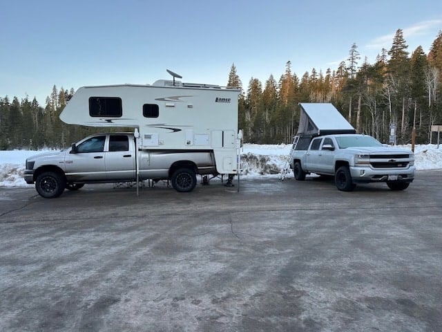 perfect for a scenic trip.|Silver pickup truck with a mounted Lance truck camper — photo 4