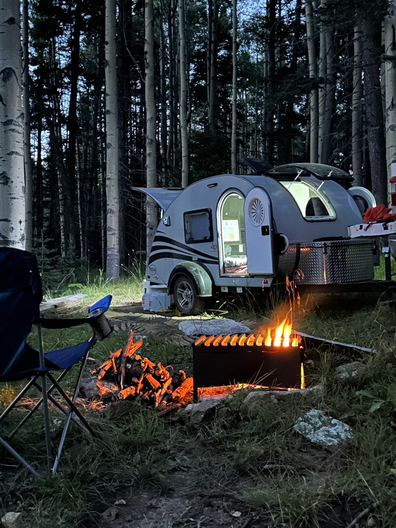 Experience peaceful forest camping with an RV rental! A small teardrop camper