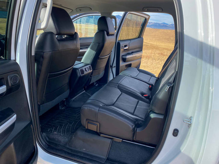 and a custom floor storage system. Great for RV rental use.|Spacious black leather rear passenger seats & durable floor mats in an SUV