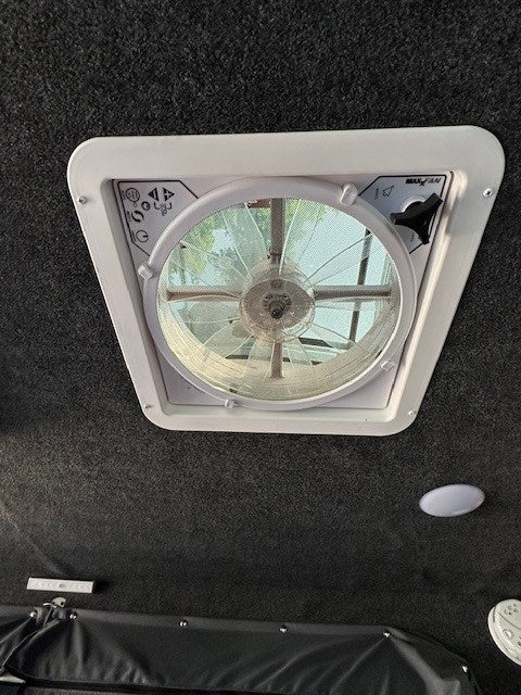 parked beside a house. Ready for adventure.|Perfect RV rental setup: outdoor kitchen with Dometic two-burner stove