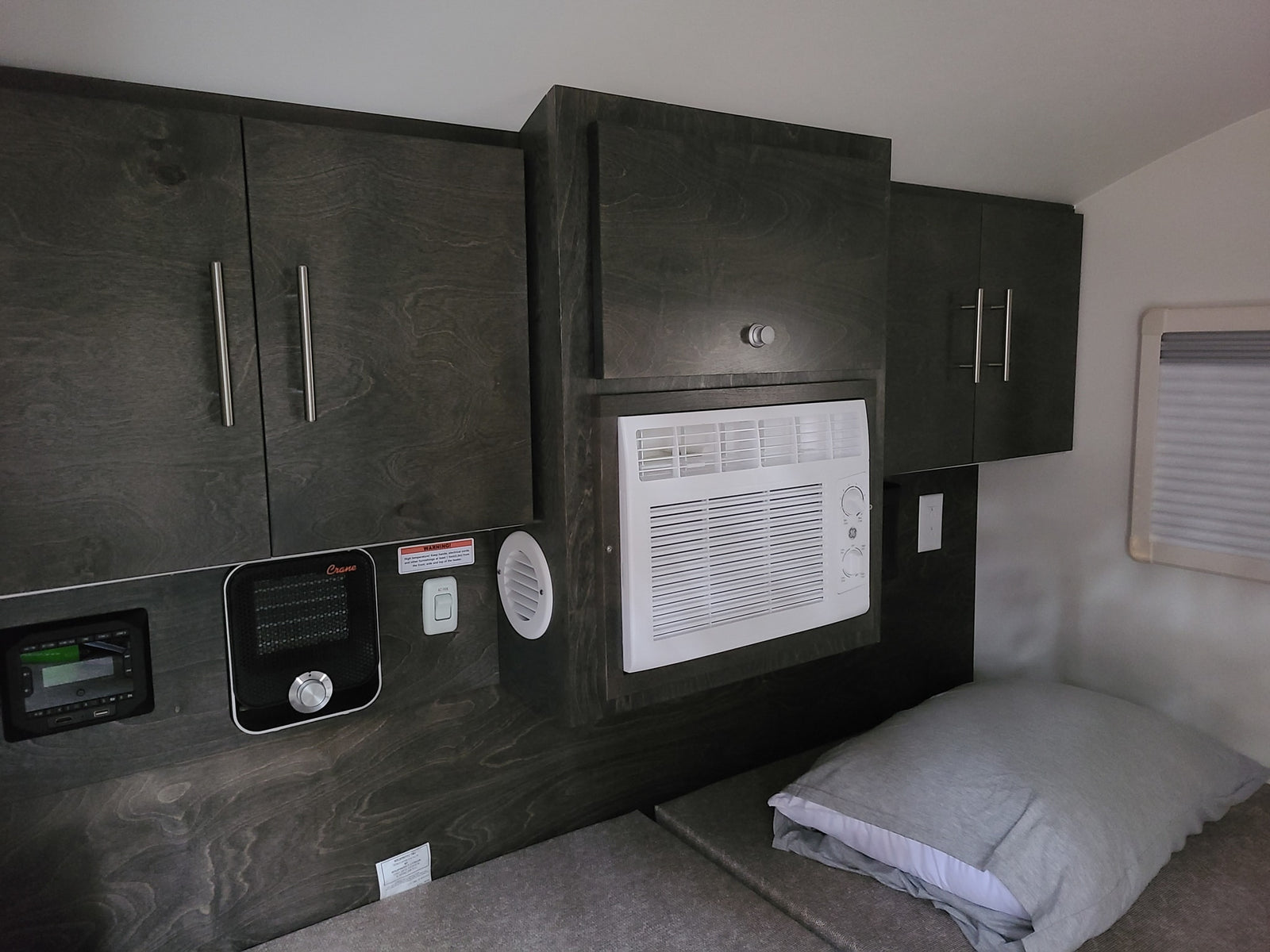 and cooler for camping.|RV rental interior: bed