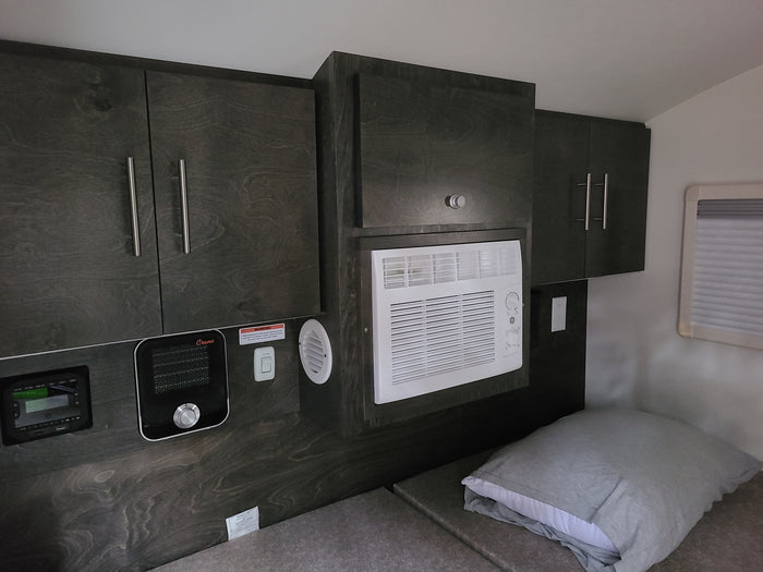 and cooler for camping.|RV rental interior: bed