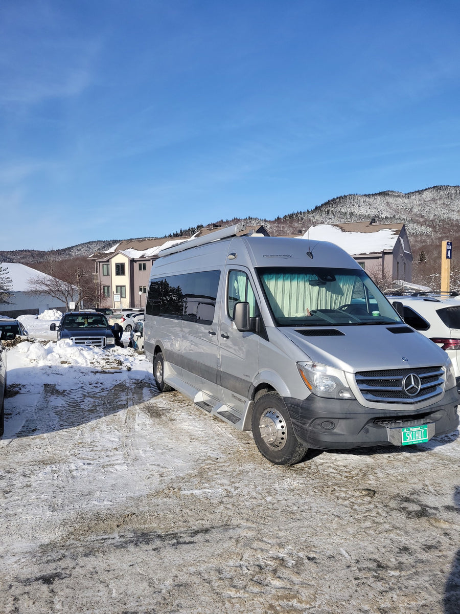 and essential amenities for travel.|This RV rental bathroom features a compact sink