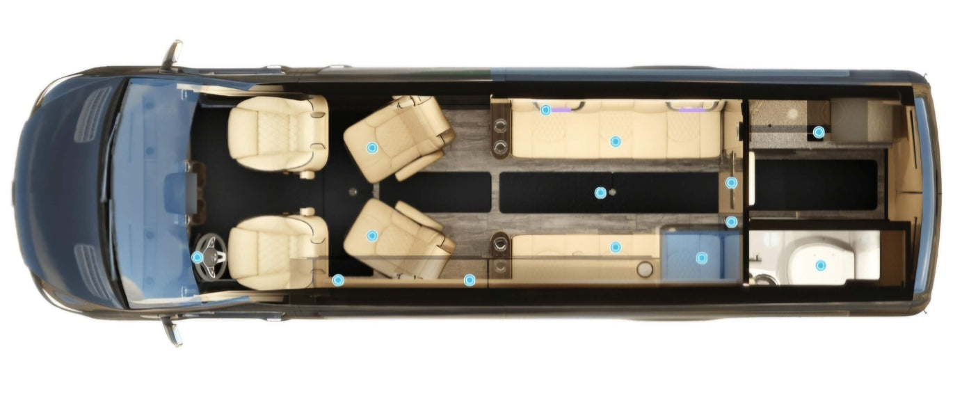 Top-down view of a spacious rv rental interior, featuring plush seating, a well-appointed kitchen, and a private bathroom.