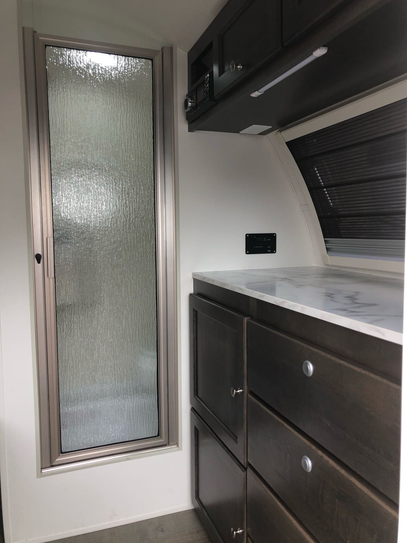 perfect for your rv rental getaway.|This RV rental features a cozy sleeping area with gray cushions