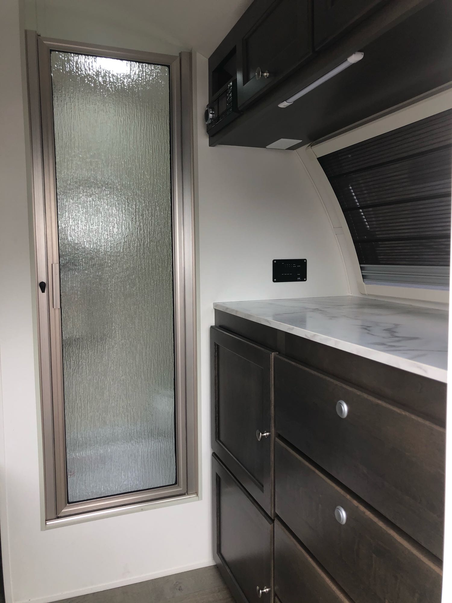 perfect for your rv rental getaway.|This RV rental features a cozy sleeping area with gray cushions