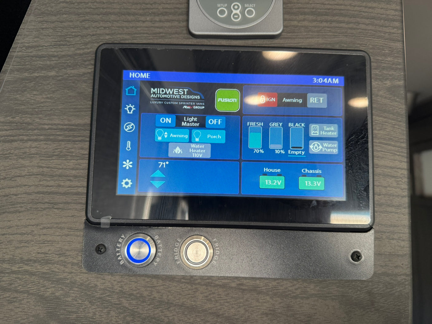 RV rental's smart control panel shows water tank levels, battery status, temperature, and appliance controls.