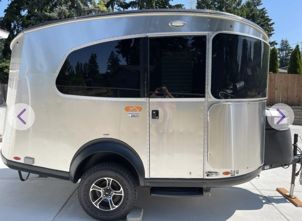 A sleek silver travel trailer