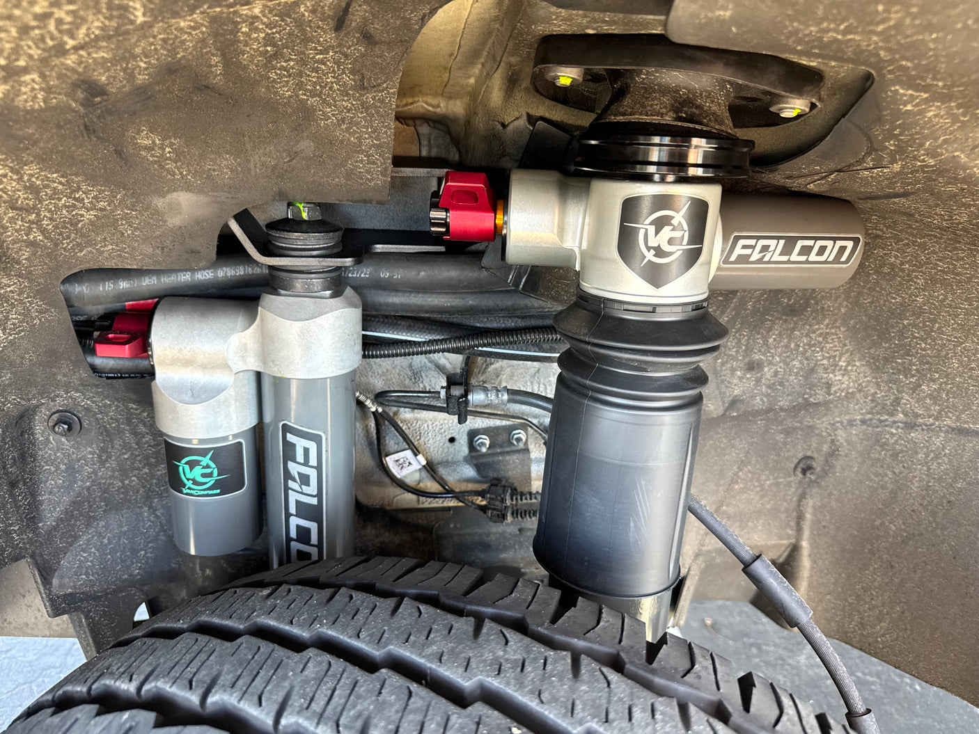 Upgraded Falcon suspension components with air springs on an RV rental, providing enhanced ride comfort and stability.