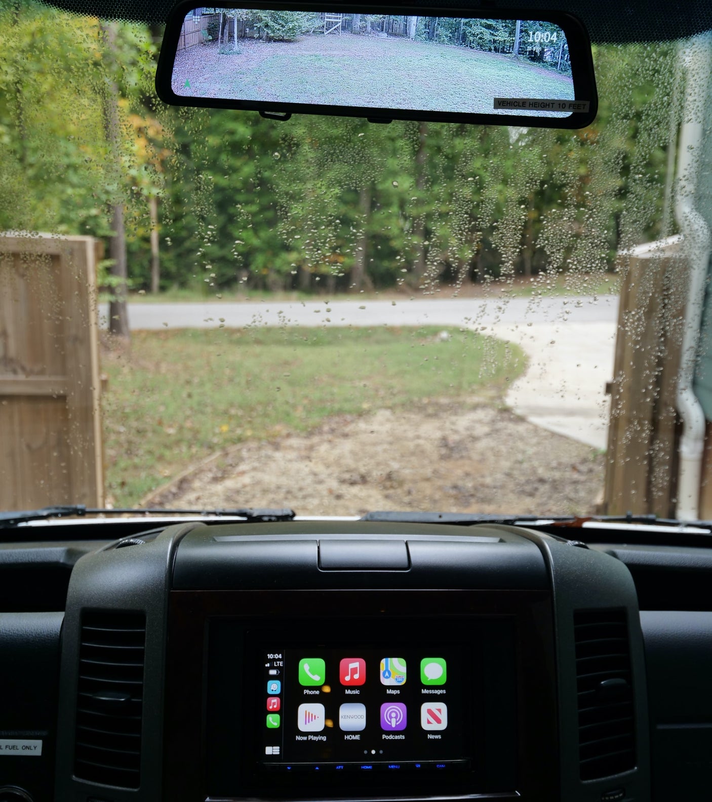 a modern RV rental. Rear/side view of a sleek camper van with tinted windows.|Compact RV rental bathroom with a white toilet